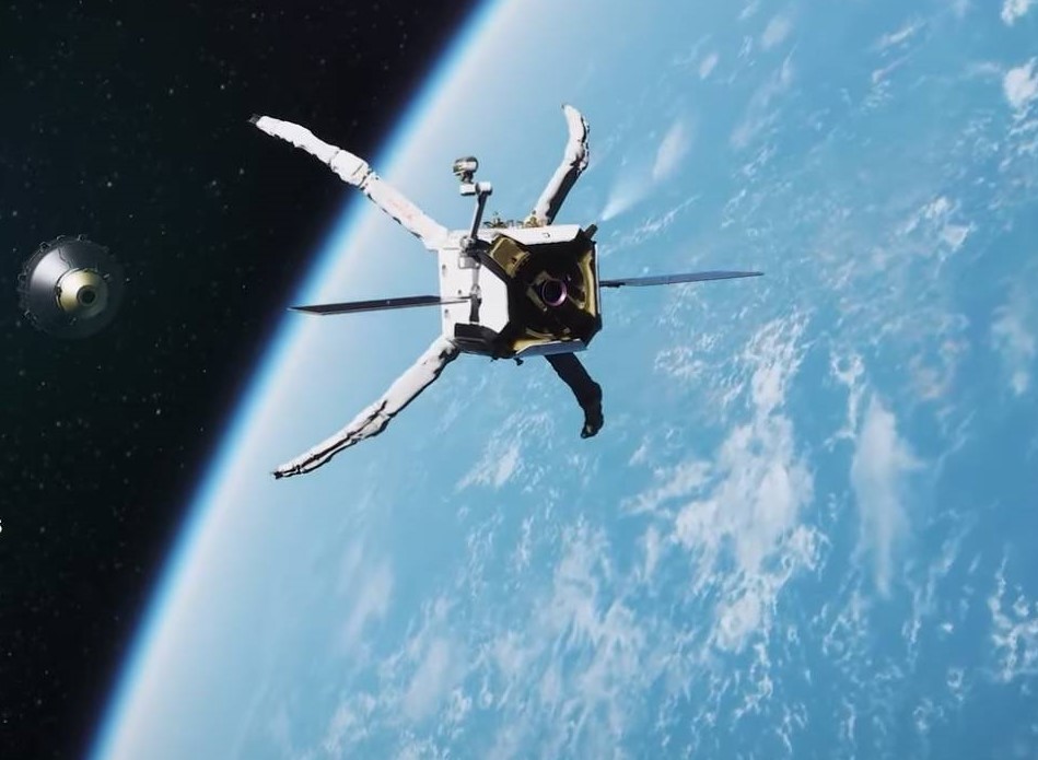 sebuah satelit dengan mekanisme seperti cakar menangkap serpihan lain di orbit